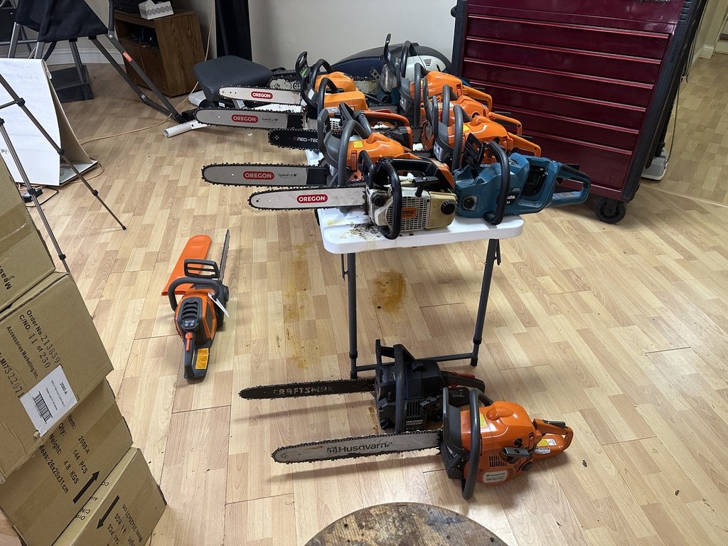 A table full of chainsaws in the shop