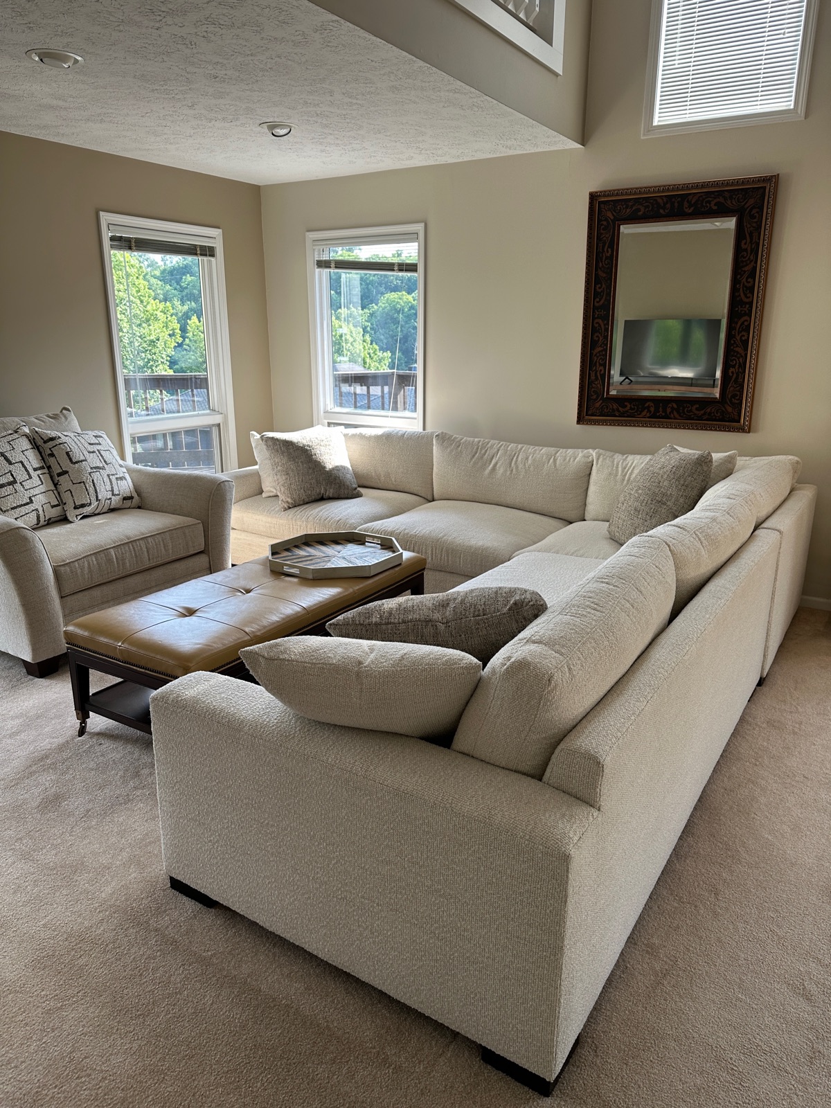 New living room in Harbour Pointe #53 with a 12-foot couch