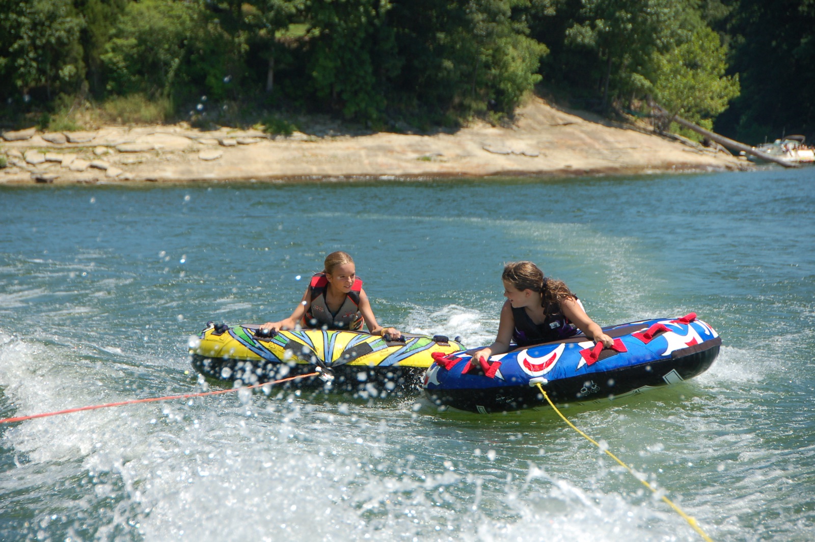 Kids riding tubes on Lake Monroe