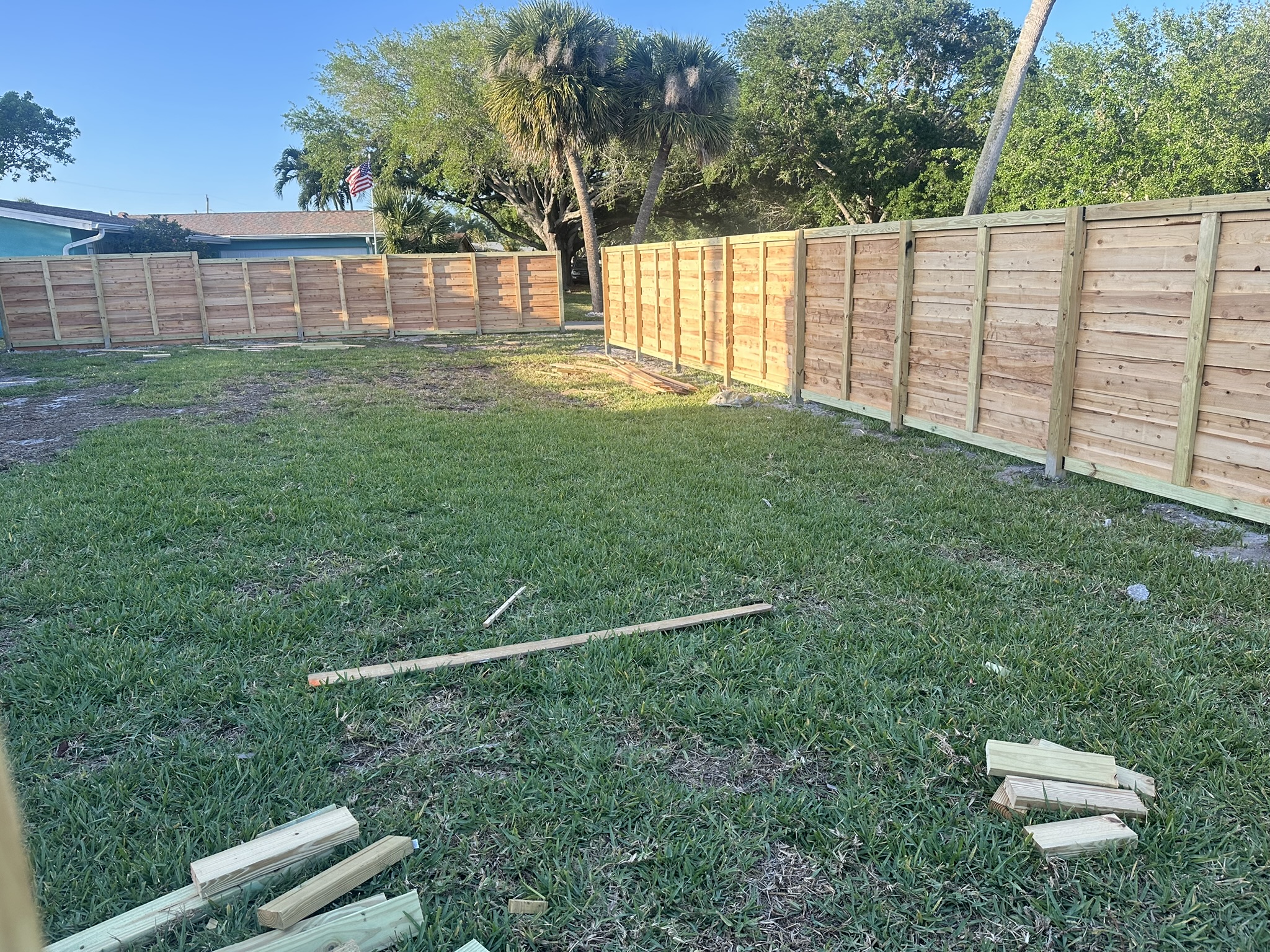 The finished wooden fence in Drew's yard in Indian Harbour Beach, Florida